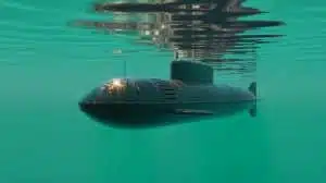 Illustration of a homemade submarine named Big Black Fish, crafted by a retired Chinese farmer, diving into the Fengle River.