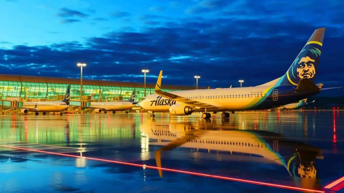 Illustration of Alaska Airlines aircraft grounded due to an IT outage, leaving passengers stranded, created by artificial intelligence.