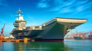 Illustration of a newly constructed vessel in Guangzhou, China, believed to be an advanced aircraft carrier.