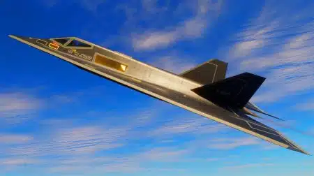 Illustration de l'avion furtif F-117 Nighthawk en vol, symbole de la technologie aéronautique avancée.